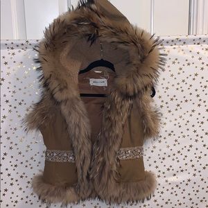 Fur vest with rhinestone detail. Real fur.